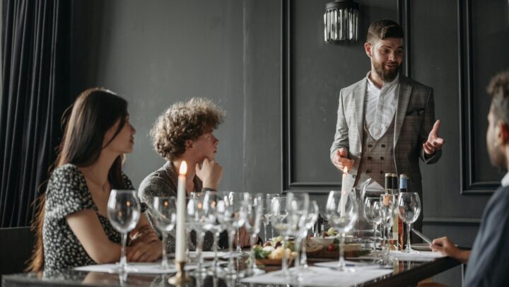 pexels-photo-8775090-8775090 Friends enjoy an elegant wine tasting guided by a sommelier in a stylish indoor setting.